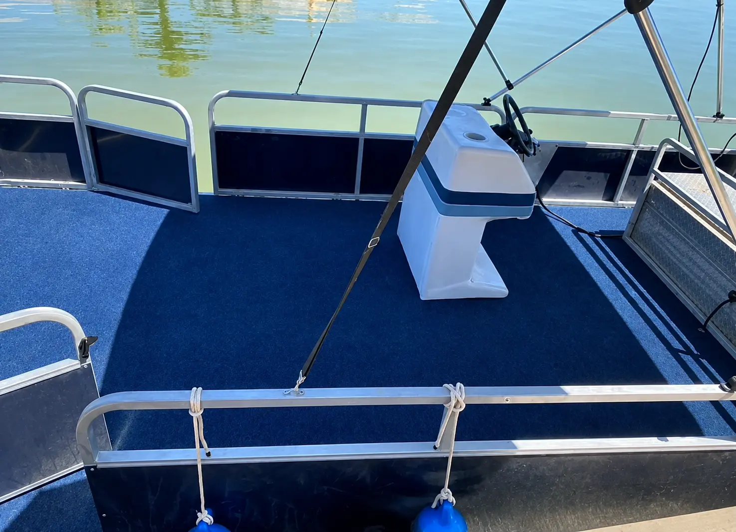 Finished blue marine carpet installed on a pontoon boat