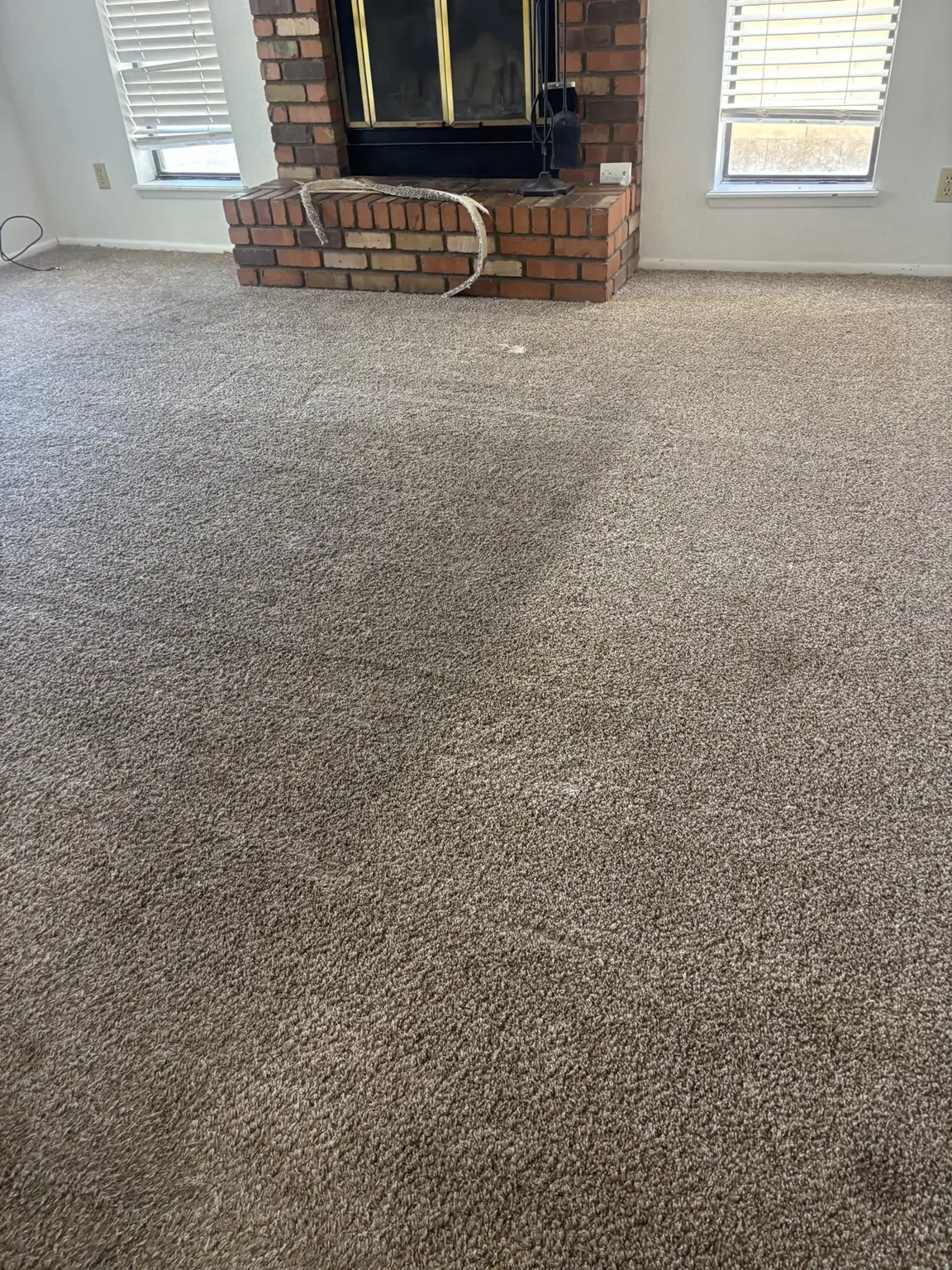 Smooth wall-to-wall carpet after whole-room restretching